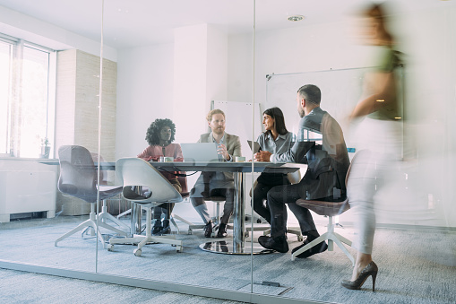 Team collaborating on a whiteboard with sticky notes